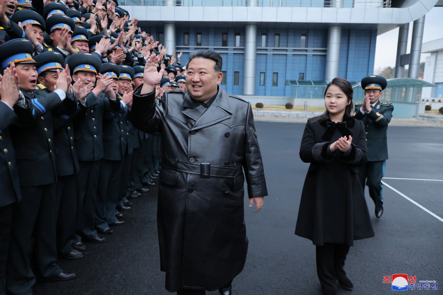 경애하는 김정은동지께서 국가항공우주기술총국을 찾으시여 정찰위성발사성공에 공헌한 과학자,기술자들과 함께 기념사진을 찍으시였다